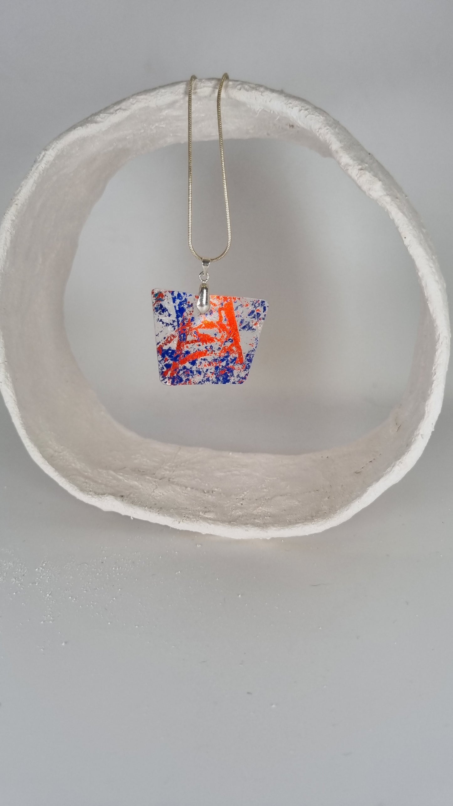 Red and blue metalic print over clear plastic bottle necklace - PLASTIQUE By Siân