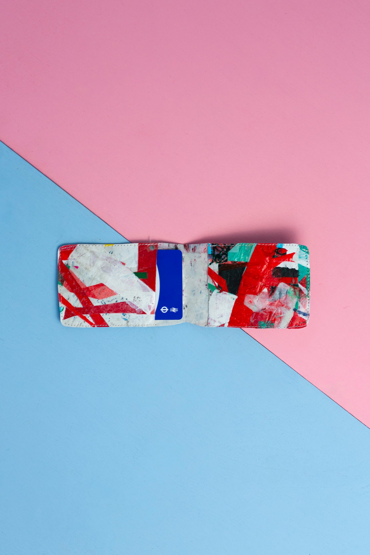 Card wallet: Green, black, blue, red and white stitched from upcycled plastic