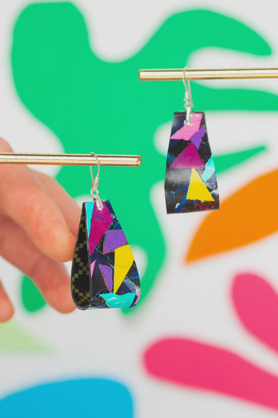 Load and play video in Gallery viewer, Medium striking colourful folded 80s earrings in pink, yellow, purple, green on black - S/S 24
