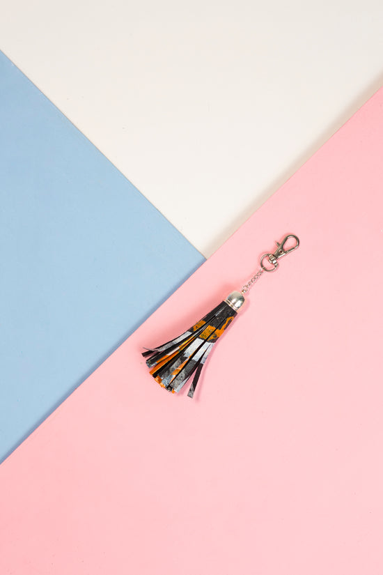 Keyring: Large black white and orange tassel accessory clip