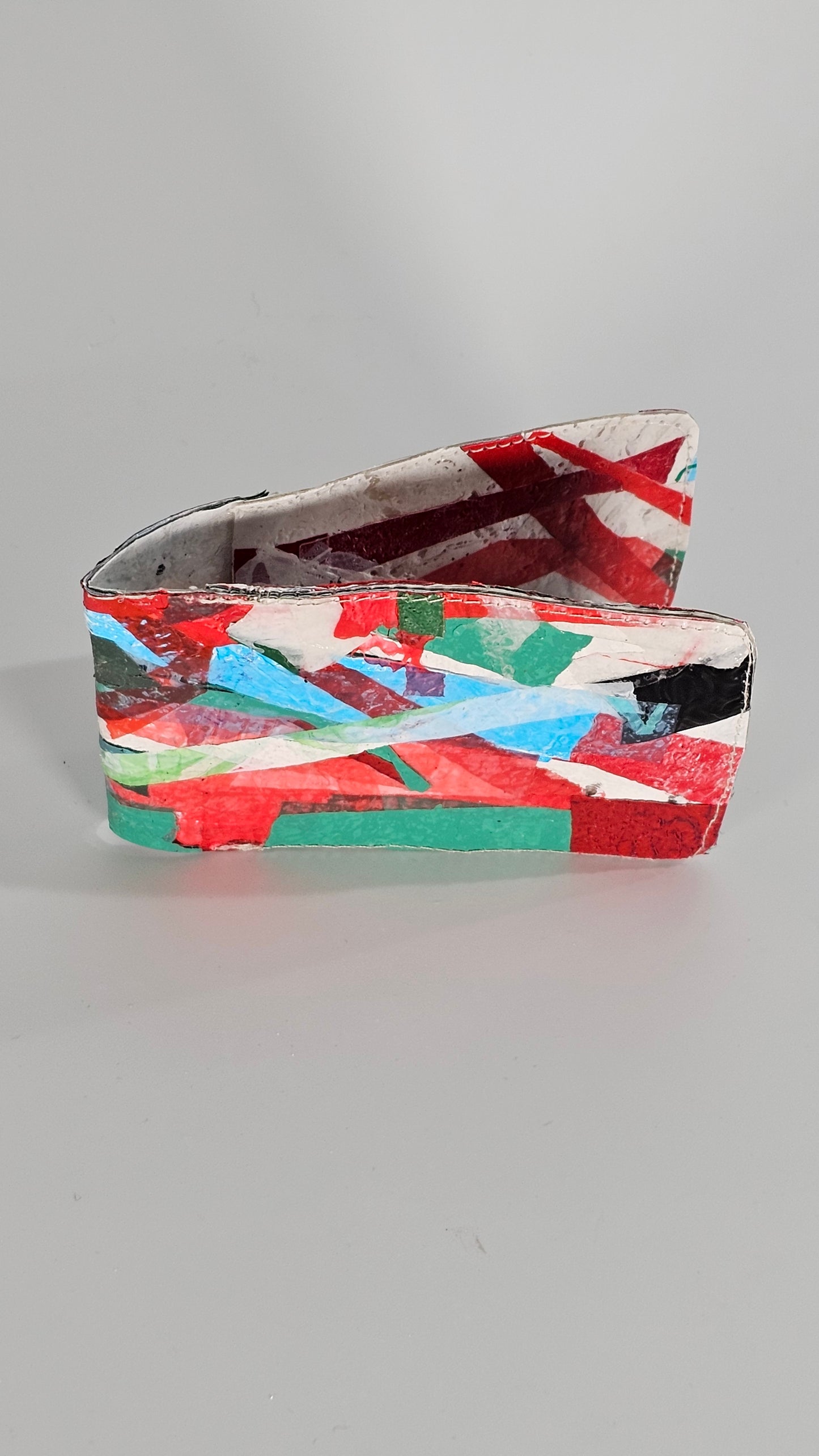 Card wallet: Green, black, blue, red and white stitched from upcycled plastic - PLASTIQUE By Siân