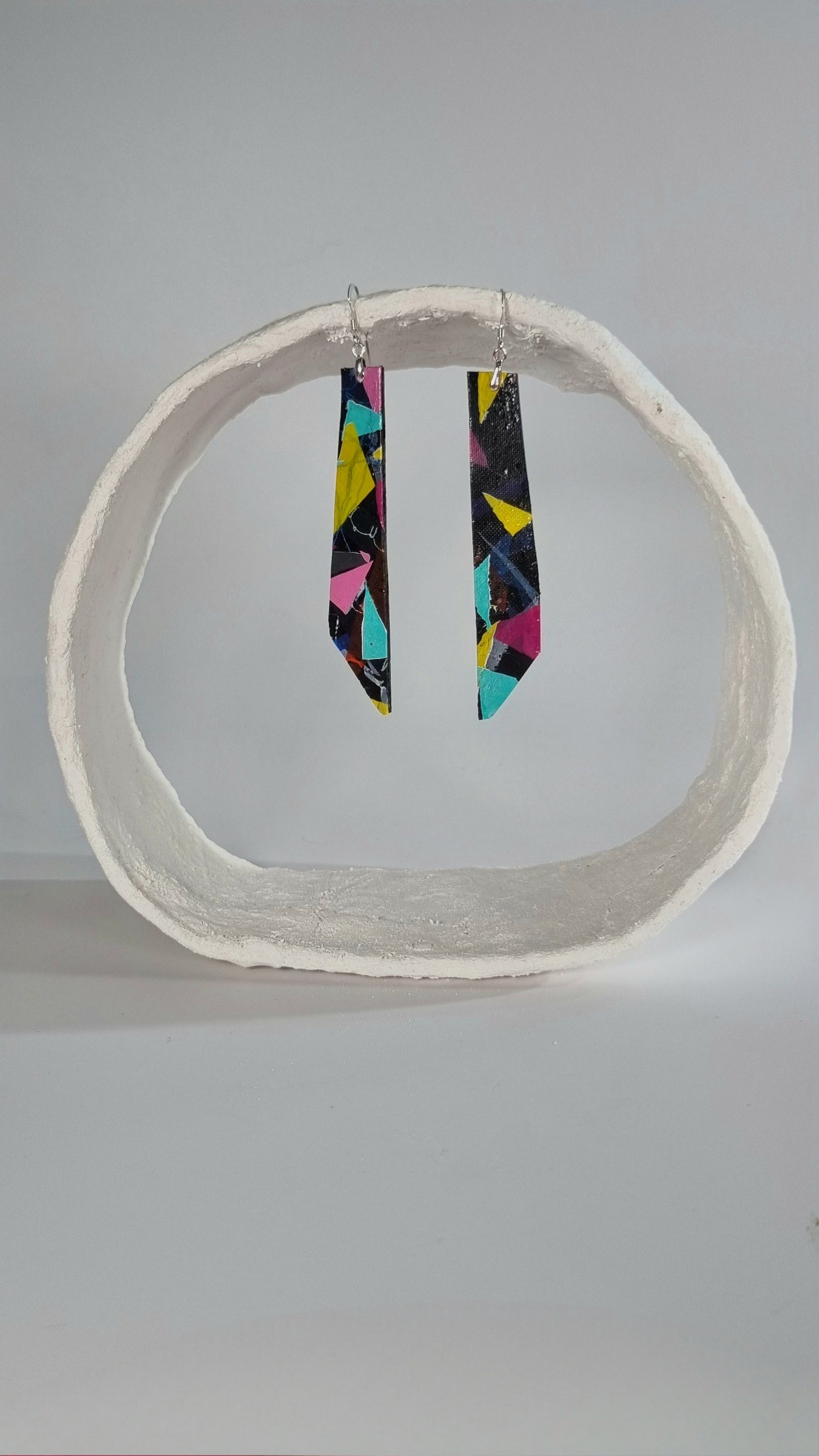 Large striking colourful long thin 80s earrings in pink, yellow, purple, green on black - S/S 24 - PLASTIQUE By Siân