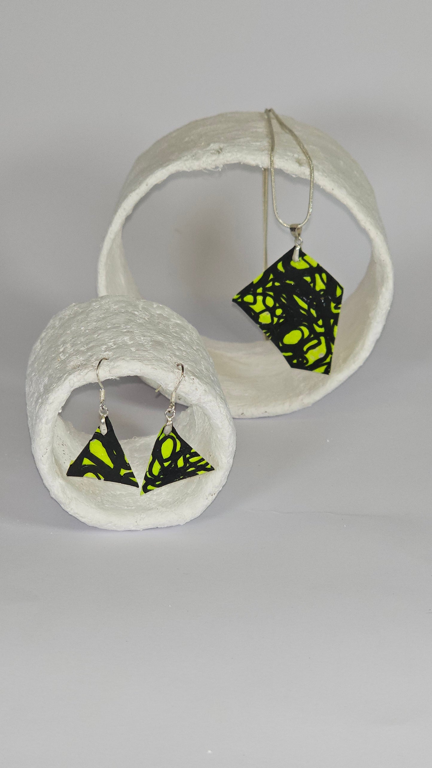 Asymetric shaped black swirl design on lime green jewellery set