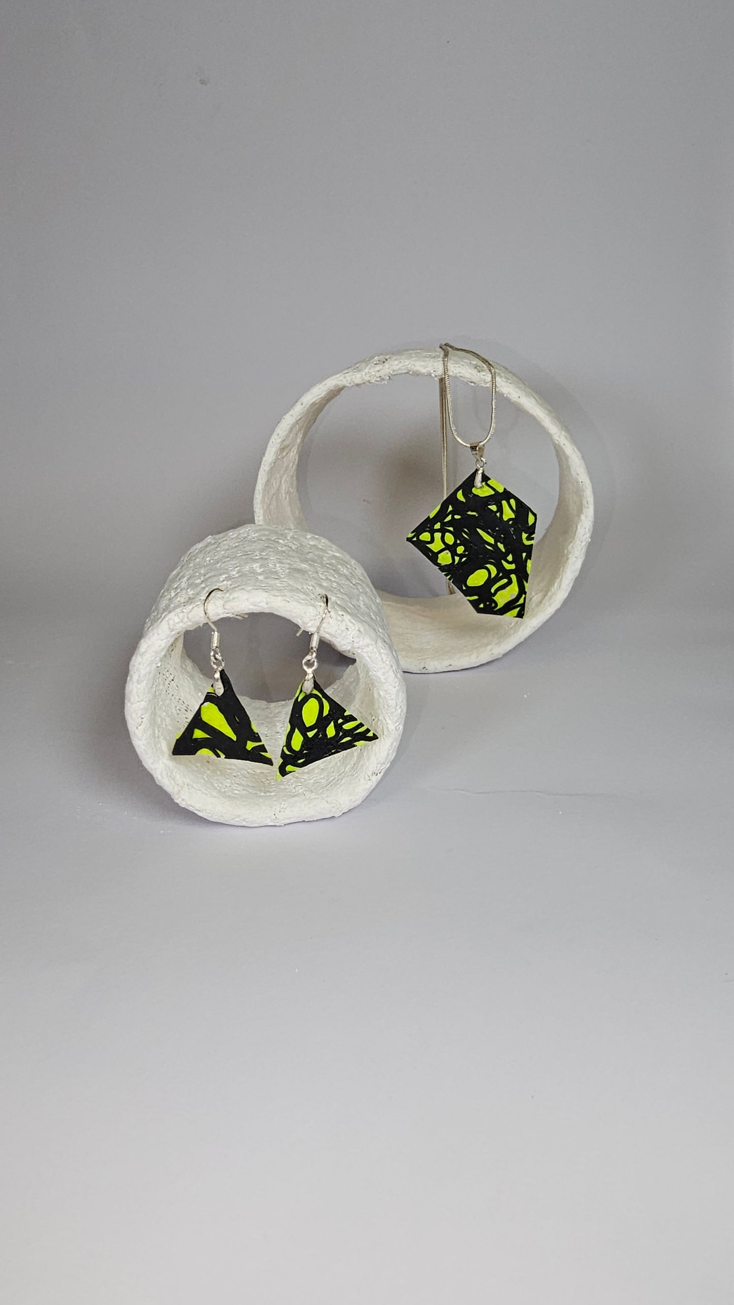 Asymetric shaped black swirl design on lime green jewellery set