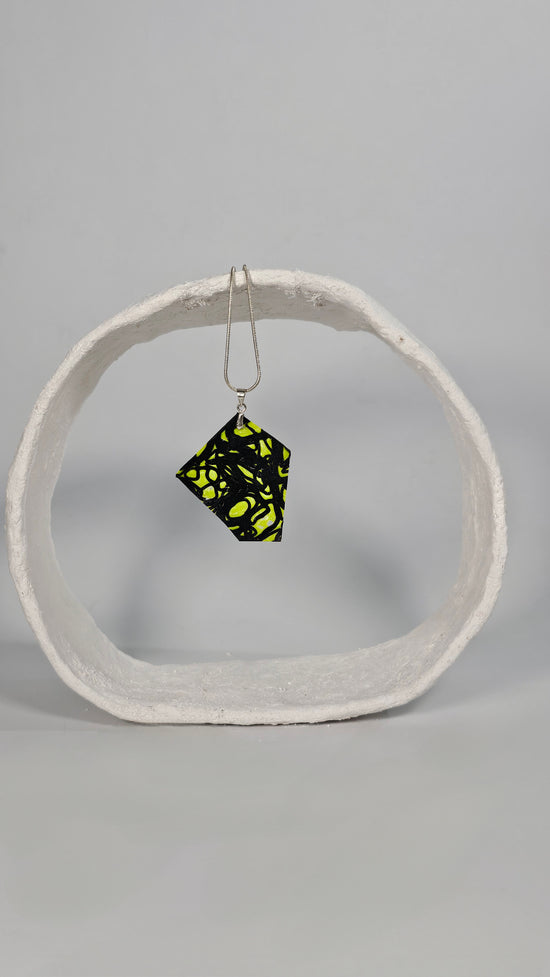 Asymetric shaped black swirl design on lime green Necklace - PLASTIQUE By Siân