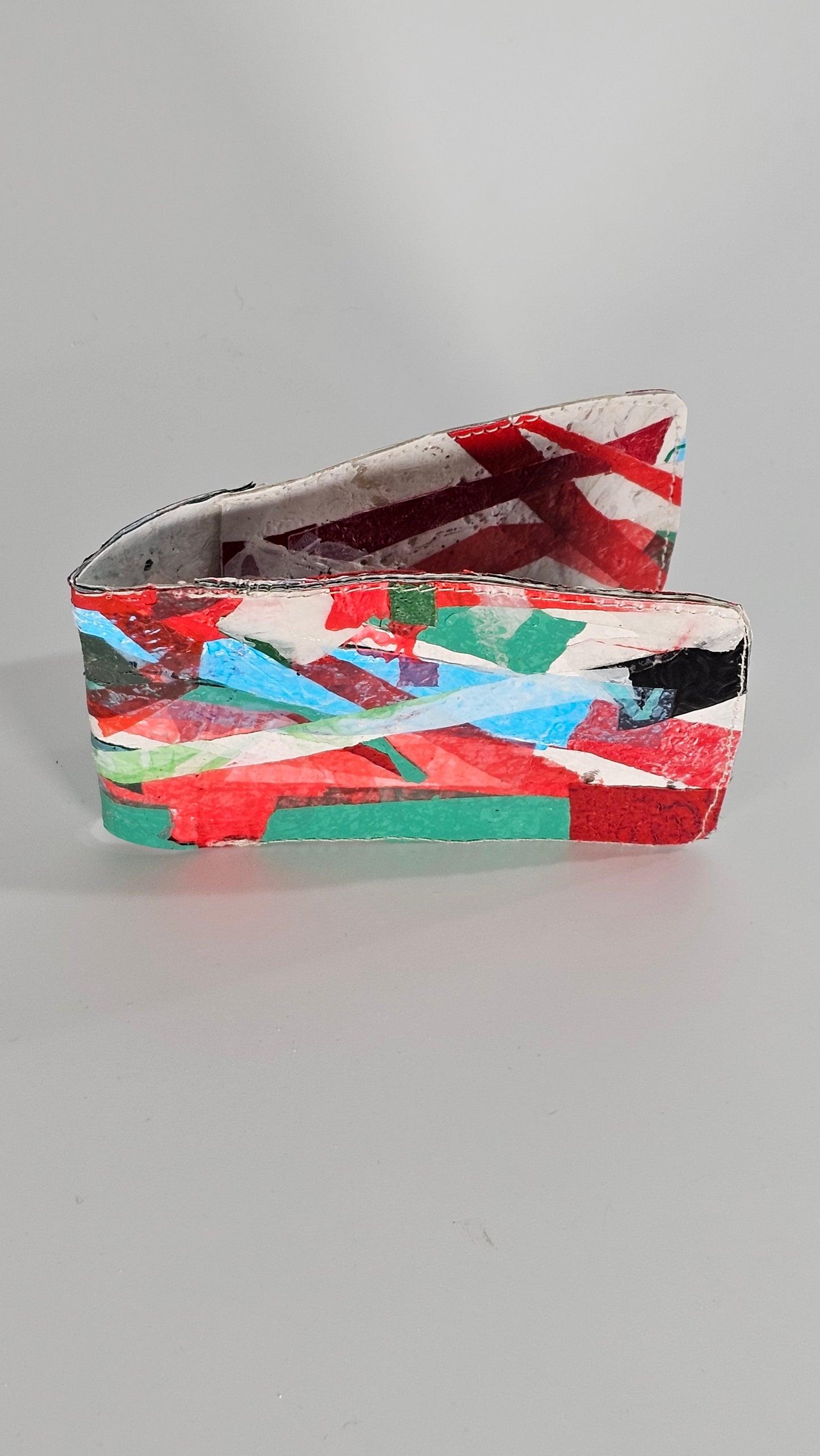 Card wallet: Green, black, blue, red and white stitched from upcycled plastic - PLASTIQUE By Siân