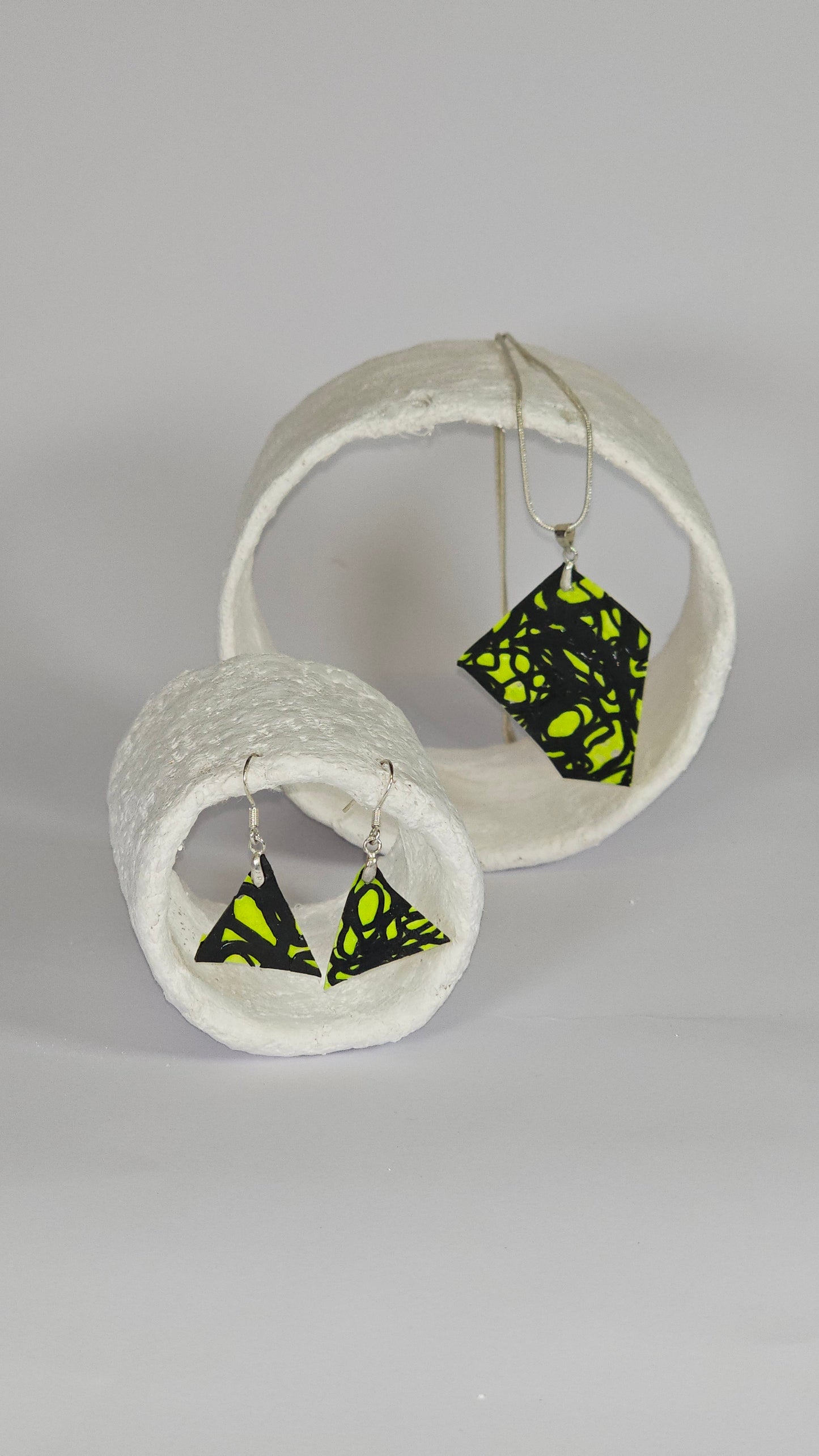 Asymetric shaped black swirl design on lime green jewellery set